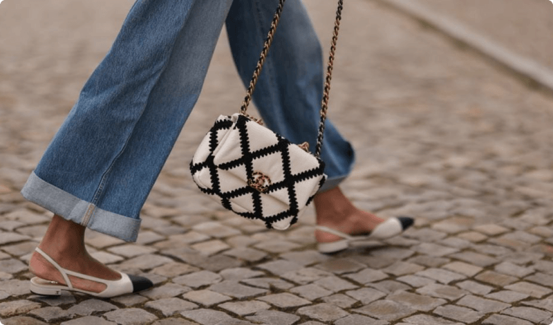 Person Walking with Chanel Bag