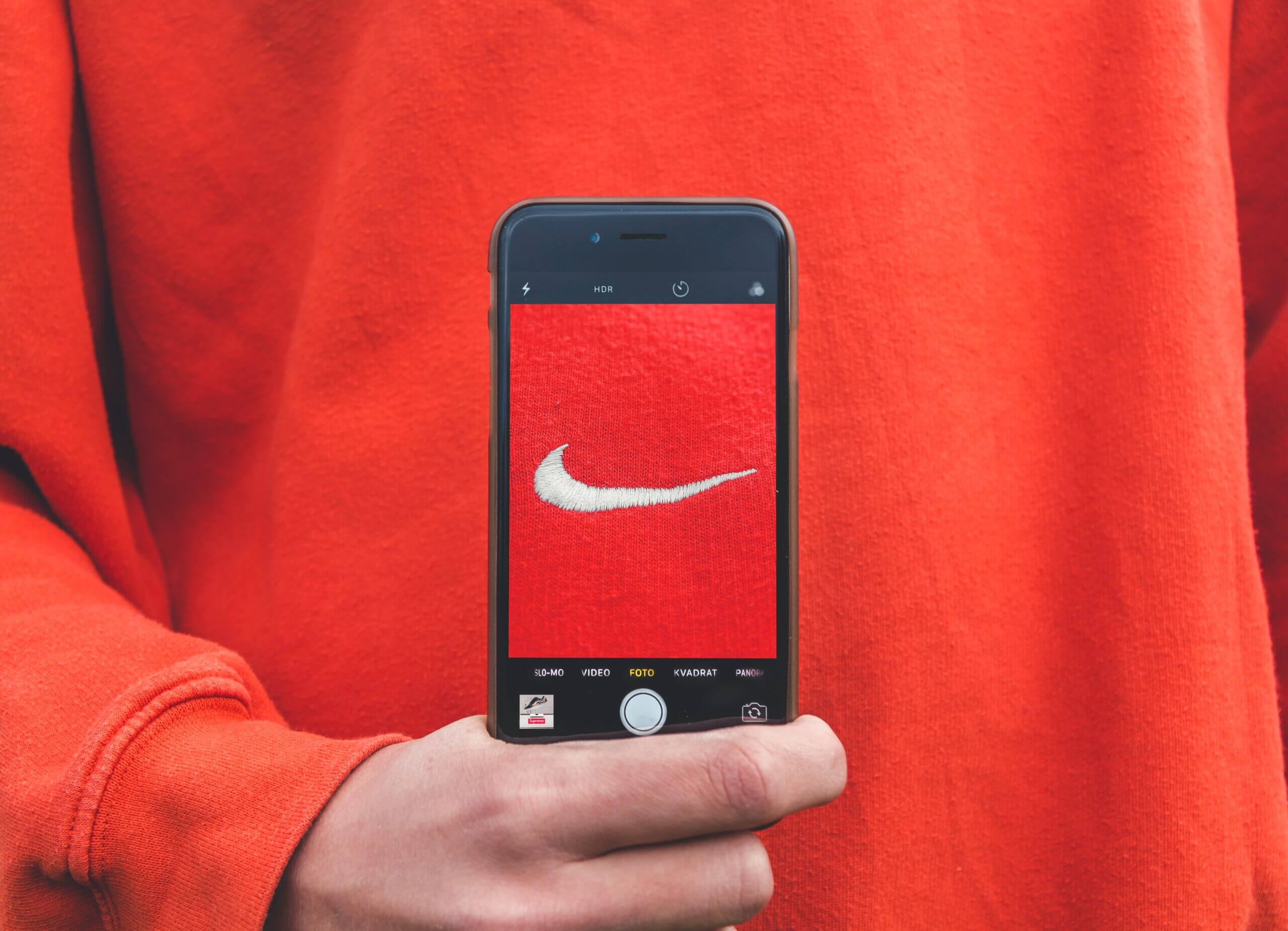 Red Nike sweater viewed through iPhone camera